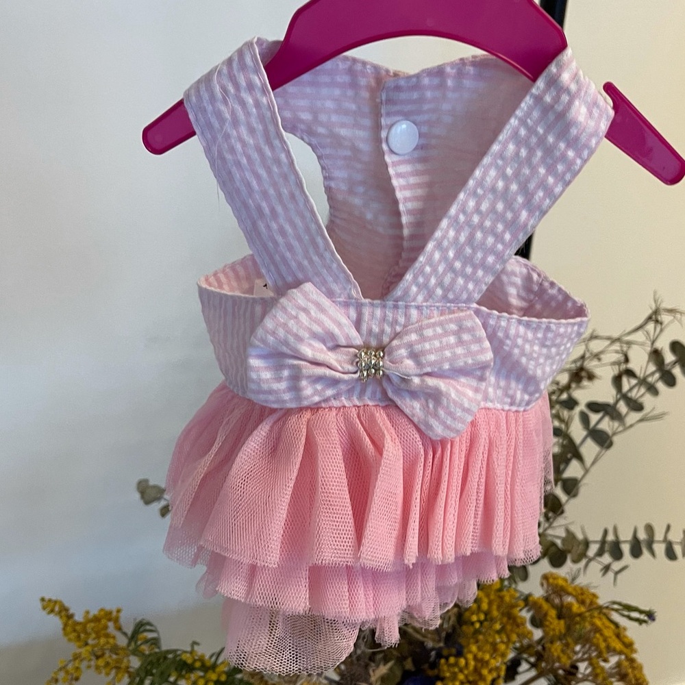 Pink striped dress with tutu and a bow
